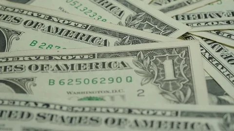One dollar bills with numbers and symbols lie in disorder Stock Footage 121508095