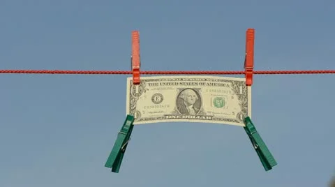 One dollar on clothes line with clothes-pins Stock Footage 11383790