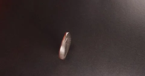 One Dollar coin, Eisenhower Dollar spinning on dark surface. Stock Footage 172116418