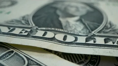 ONE DOLLAR. Macro video. Close-up of isolated dollar bills being laid on the Video stock 177057407