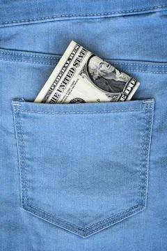 One dollar note in the back pocket of blue jeans Stock Photos