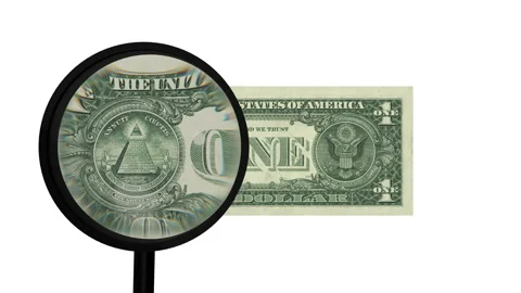 One dollar note inspected closely by a magnifying glass on white background Video stock 130416215