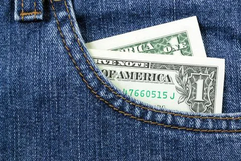 One dollar in pocket Stock Photos