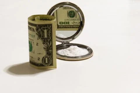 One dollar with reflection of one hundred dollars in a lady mirror Stock Photos