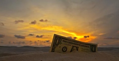 One dollar on a sunset 스톡 사진
