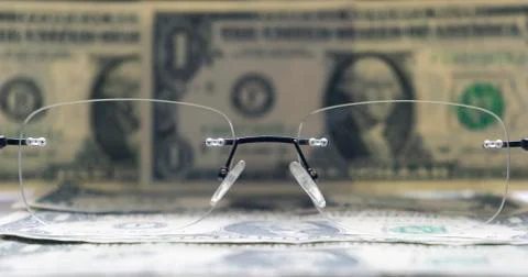 One dollars banknotes as a background and glasses Stock Photos