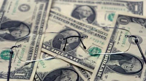 One dollars banknotes as a background and glasses Stock Photos