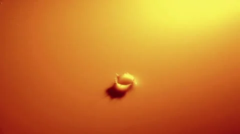 One Drop of Liquid Falling Into Orange Background 스톡 동영상 19094608