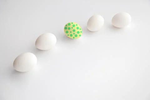 One Easter egg among the white eggs.Easter cocept Stock Photos