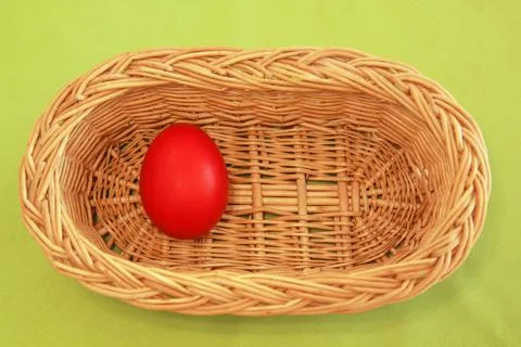 One Easter egg in basket Stock Photos