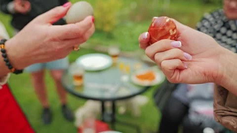 One Easter Egg Cracks During Traditional Egg Tapping Battle Between Two Adults! Stock Footage 344008131
