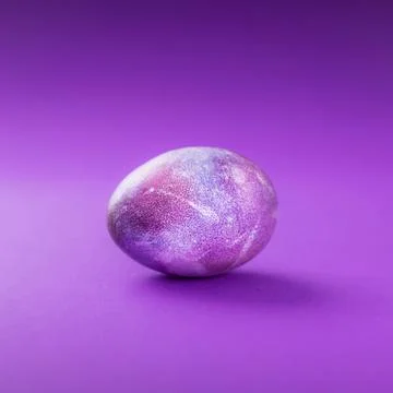 One easter egg on a violet trend Stock Photos