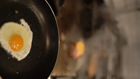 One egg is cooking - Vertical - 4k 100 fps Video stock 196144358