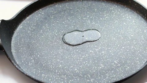 One egg pouring on granite fry pan Stock Footage 200818072