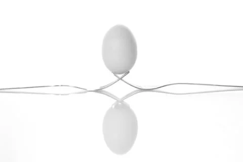 One egg on two forks Foto stock