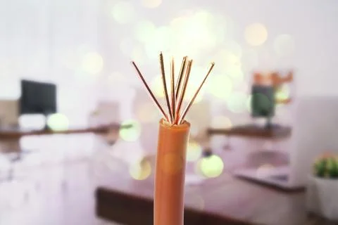 One electrical wire against blurred background, closeup. Bokeh effect Stock Photos