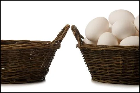 One empty basket and one filled with eggs Stock-Fotos