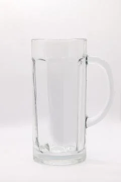 One empty beer mug with a handle on a white background Stock Photos