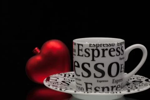 One empty coffee cup and red heart Photos