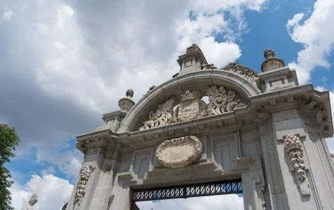 One of the entry arcs to Parque del Buen Retiro in front of blue sky, Madrid Stock Photos