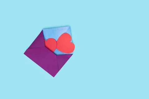 From one envelope go out two red heart. love Valentine day on 14th February Stock Photos