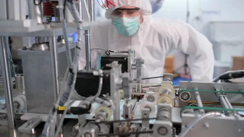 One factory worker close up check line of mask producing machine Stock-Footage 157112805