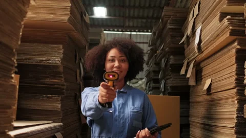 One female worker scan bar codes to check orders at parcels warehouse factory. 스톡 동영상 171098095