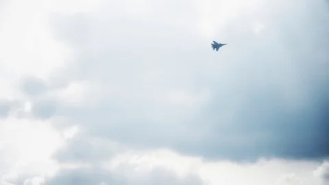 One fighter jets in the blue sky. A general plan. Aerobatic figures. Airshow. 8 Stock Footage 124143735