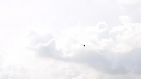 One fighter jets in the blue sky. Сountry flags. A general plan. Aerobatic Stock Footage 124144212