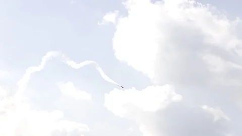 One fighter jets in the blue sky. country flags. A general plan. Aerobatic Stock Footage 124145830