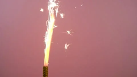 One firework sparkler burning on pink background. Stock Footage 279884645