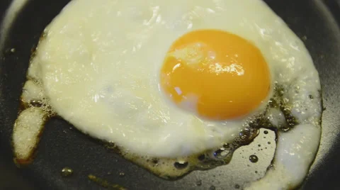 One fried egg in a pan Stock Footage 45343804