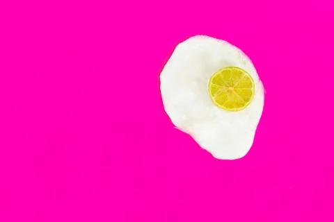 One fried egg on pink background, pop art, isolated from the right side Stock Photos