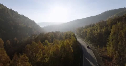 One gray silver crossover SUV car driving alone road trip, travel on freeway Vidéo 164361665