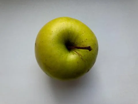 One green Apple is on the table. The view from the top. 写真素材