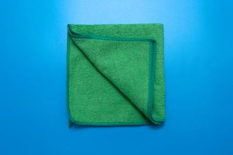 One Green microfiber cloth for different surfaces cleaning in kitchen, bathroom Stock Photos