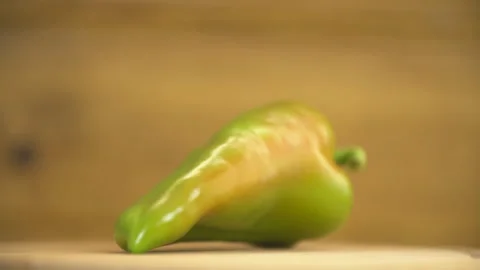 One green pepper on the table Stock Footage 129537737