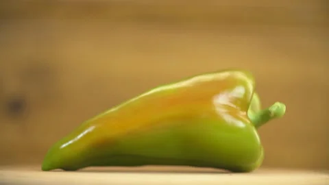 One green pepper on the table Stock Footage 129883568