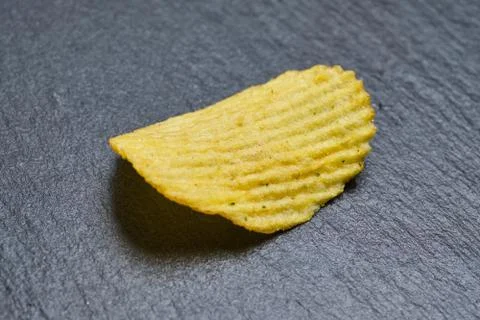 One grooved chip on a slate. Stock Photos