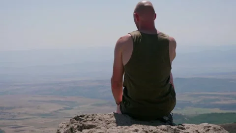 One guy is in the mountains Stock Footage 248872430