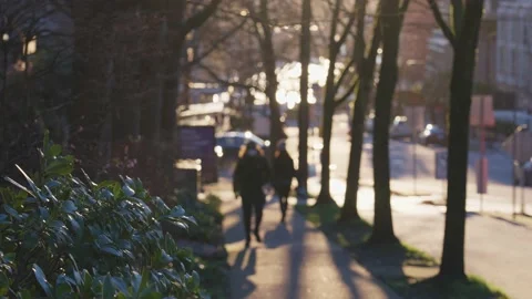 One guy with a protective mask walking down the street outside. slow motion. Video stock 145885318