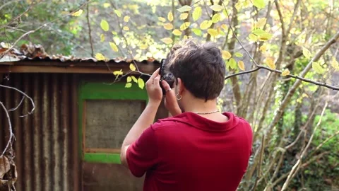 One guy with smartphone making a photography of beautiful natural scene Stock Footage 144826015