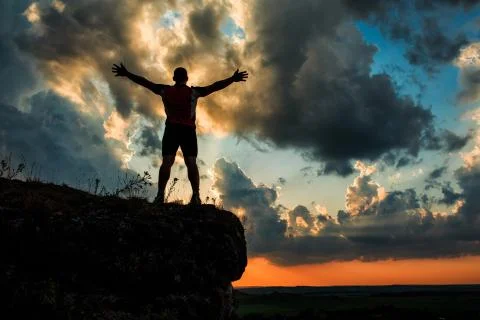One guy standing on a rock Stock Photos