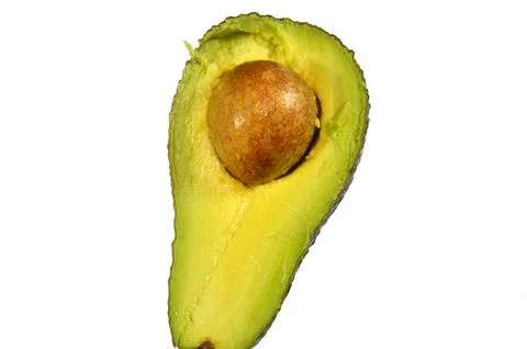One half of an avocado, a nutrient dense fruit, botanically a large berry, .. Stock Photos