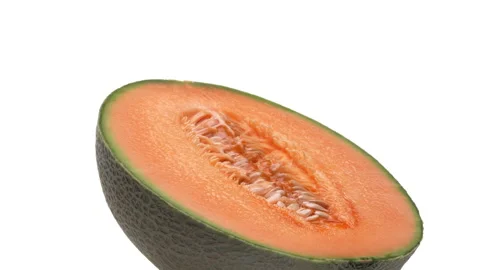 One half of a cantaloupe melon is rotating on white background. Stock Footage 169846742