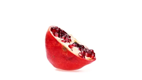 One half of a pomegranate fruit is rotating. Isolated on white background. Stock Footage 166238090