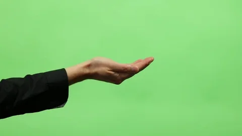 One hand holding on green screen background Stock Footage 73480243