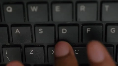 One Hand Typing On Black Computer Keyboard Video stock 150598593