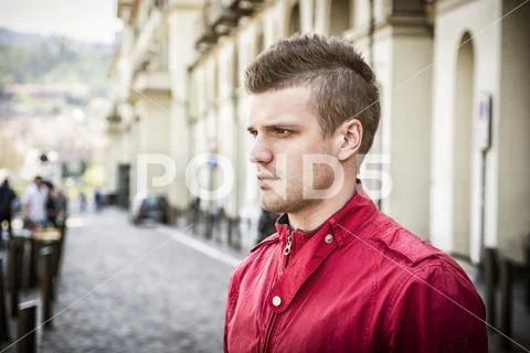One handsome young man in city setting Stock Photos