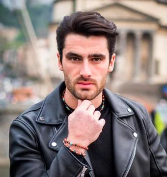 One handsome young man in modern city setting Stock Photos